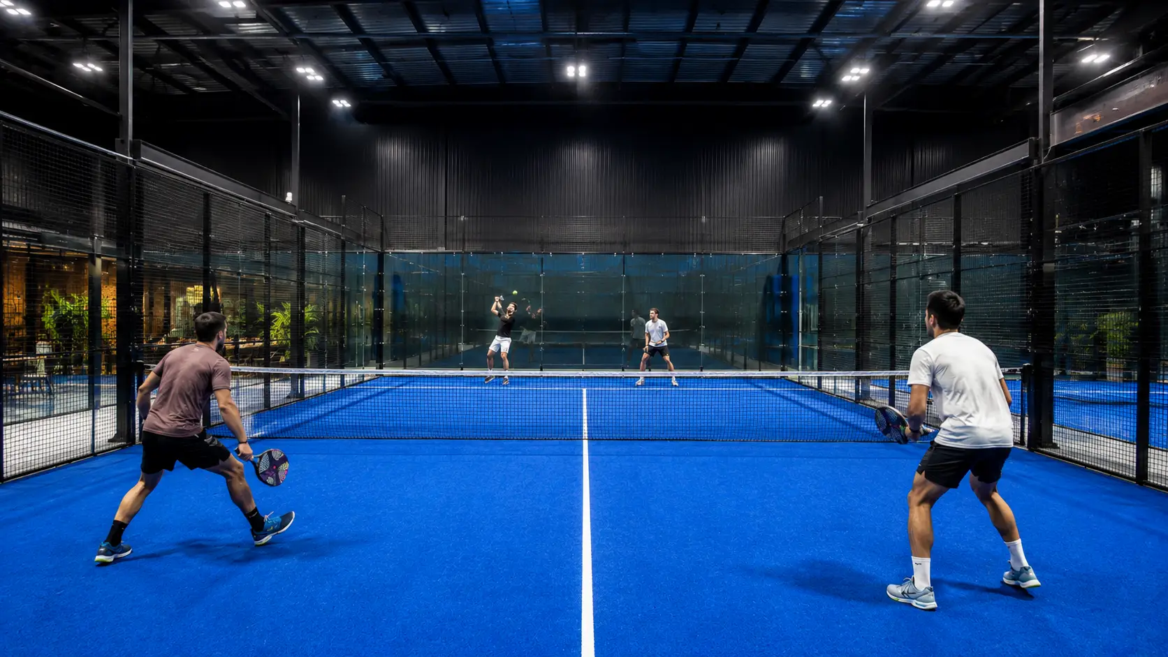 Professional indoor padel court in Delhi NCR with panoramic glass walls and climate control at REPPP by Rackonnect